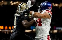 New Orleans Saints cornerback Kool-Aid McKinstry deflects a pass intended for New York Giants tight end Theo Johnson.