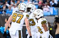 New Orleans Saints tight end Juwan Johnson (83) celebrates with Saints tight end Foster Moreau (87) after scoring a touchdown against the Carolina Panthers. 