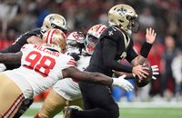 San Francisco 49ers defensive end Mykel Williams (98) applies pressure to Saints quarterback Spencer Rattler during Sunday's game in New Orleans.