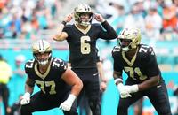 Saints quarterback Tyler Shough calls a play at the line of scrimmage at Miami.