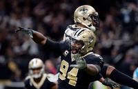New Orleans Saints defensive end Cameron Jordan (94) and cornerback Marshon Lattimore (23) celebrate a defensive stop.