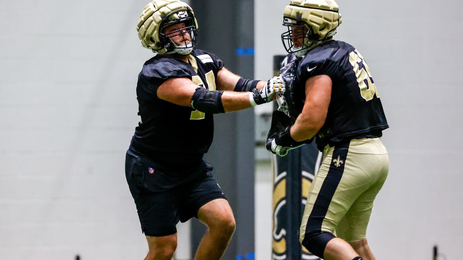 Who will start at left guard for Saints?
