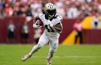 New Orleans Saints running back Alvin Kamara rushes the ball in the first half of a game against the Washington Football Team, Sunday, Oct. 10, 2021, in Landover, Md.
