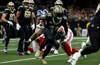 New Orleans Saints running back Alvin Kamara carries the ball against the New York Giants.