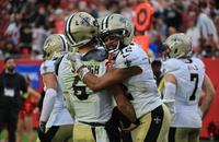 New Orleans Saints quarterback Tyler Shough (6) and wide receiver Chris Olave (12) celebrate after scoring a touchdown against the Tampa Bay Buccaneers.