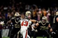 New Orleans Saints offensive linemen Cesar Ruiz (51) and Luke Fortner (79) block Tampa Bay Buccaneers linebacker Chris Braswell (43).