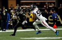 New Orleans Saints running back Devin Neal carries the ball against the Atlanta Falcons.
