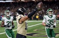New Orleans Saints wide receiver Chris Olave (12) celebrates a touchdown reception as New York Jets cornerback Brandon Stephens (21) and safety Dean Clark (35) look on during the third quarter of Sunday's game at Caesars Superdome.