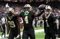 Saints cornerbacks Kool-Aid McKinstry, Alontae Taylor and Quincy Riley celebrate after an interception against the Giants.