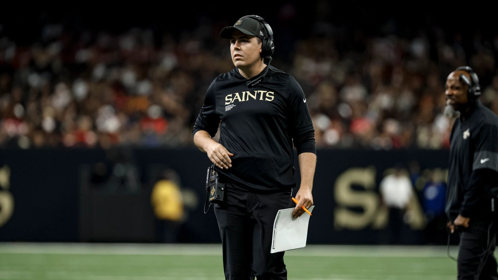 How is Kellen Moore performing as a play caller?