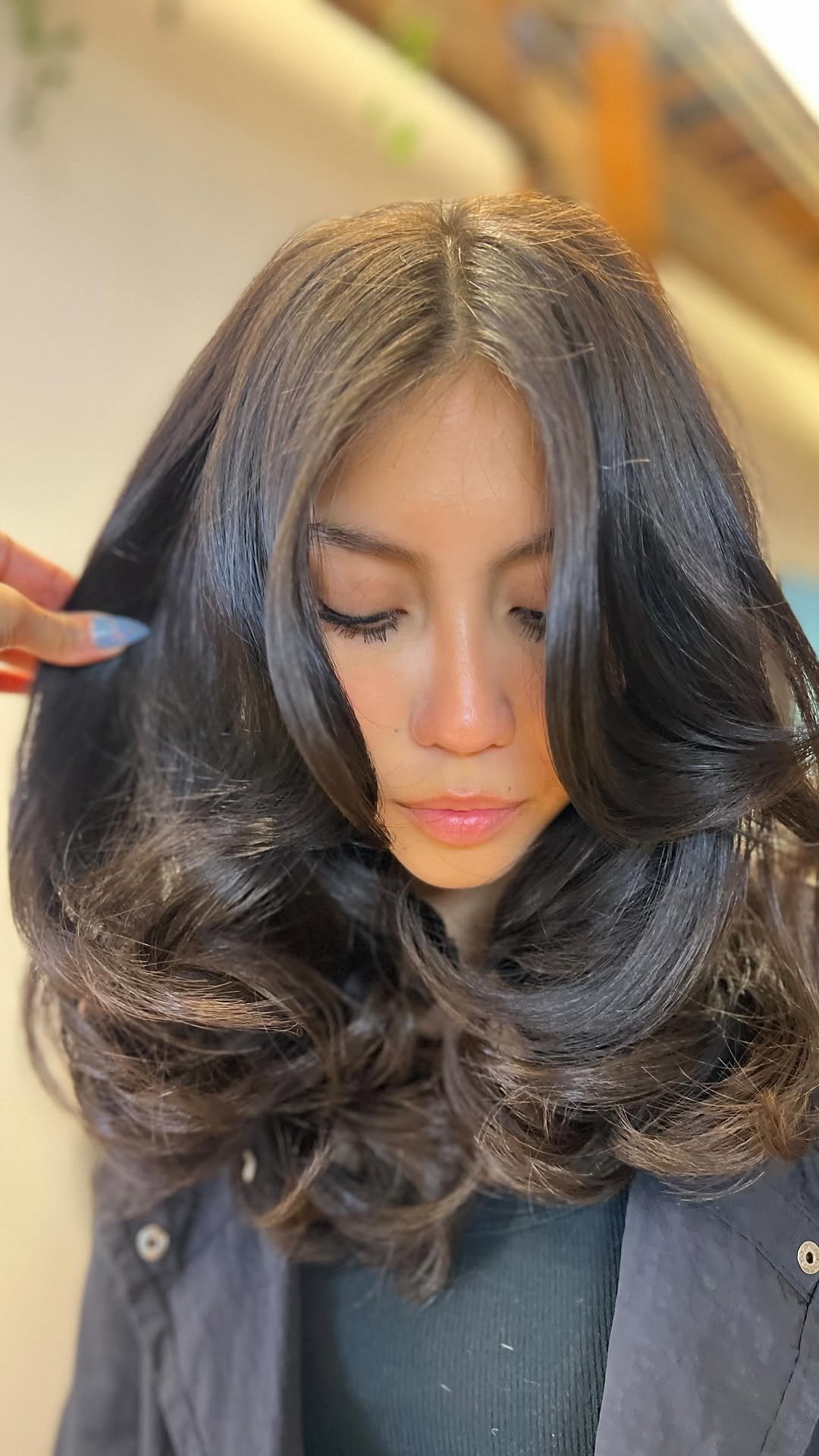 Long layers with face framing and curtain bangs