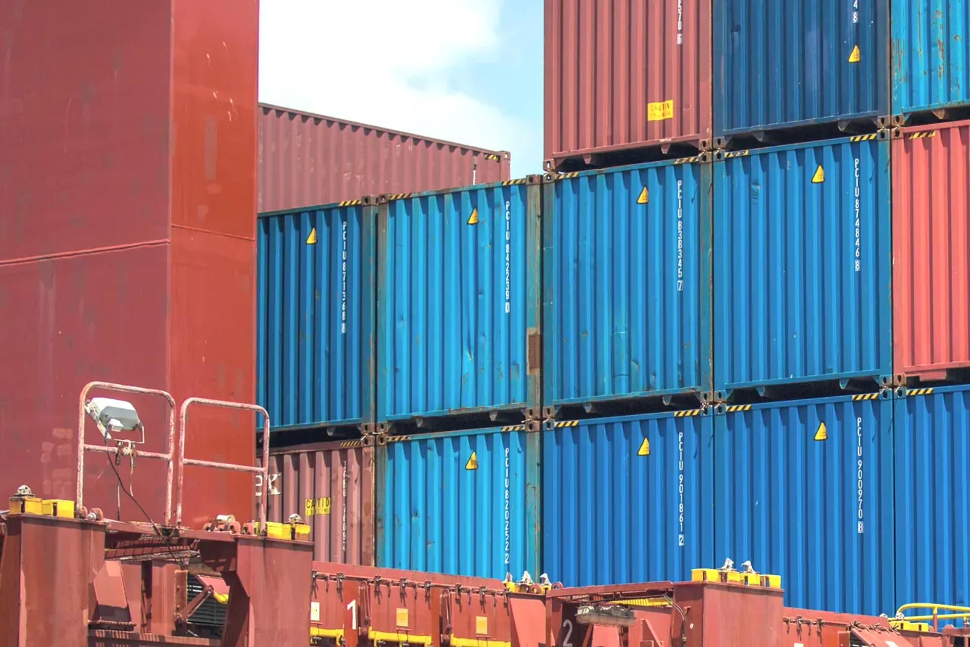 Blue containers stacked on a vessel alongside at the Port of Mombasa