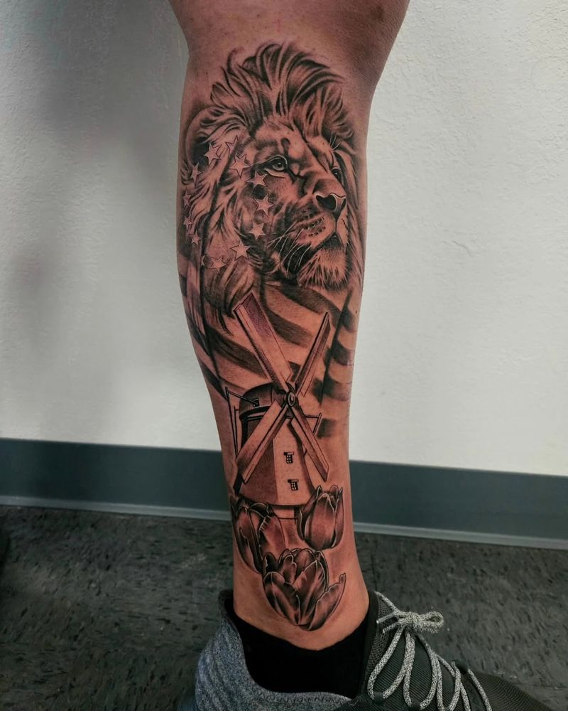Black and grey lion realism calf tattoo by Sergio