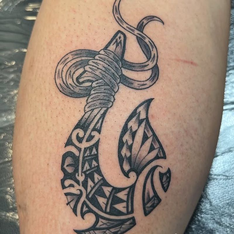 Polynesian fish hook tattoo by Tomo
