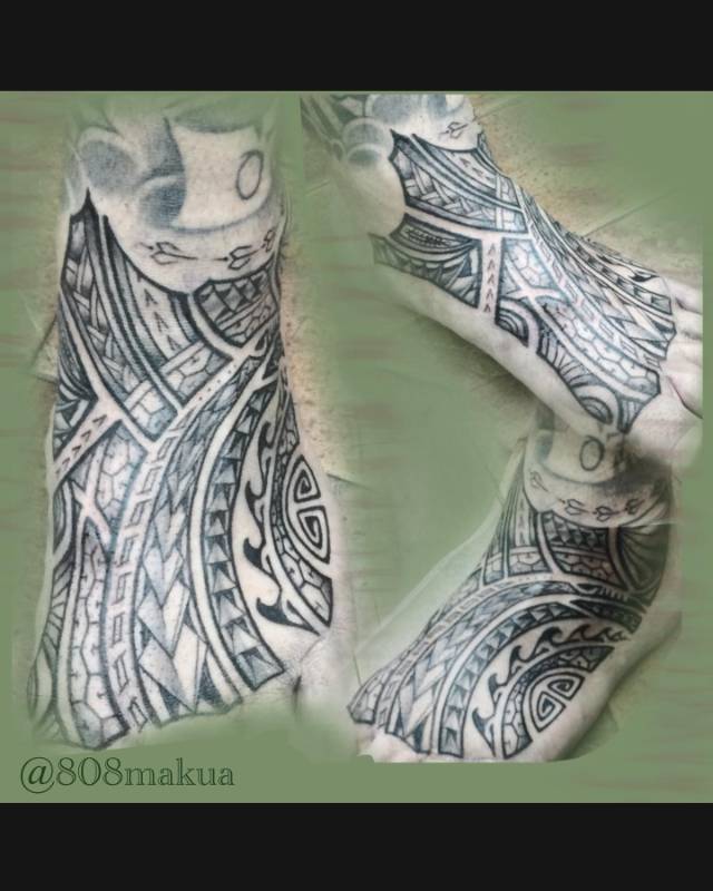 Tribal tattoo on the foot with geometric designs
