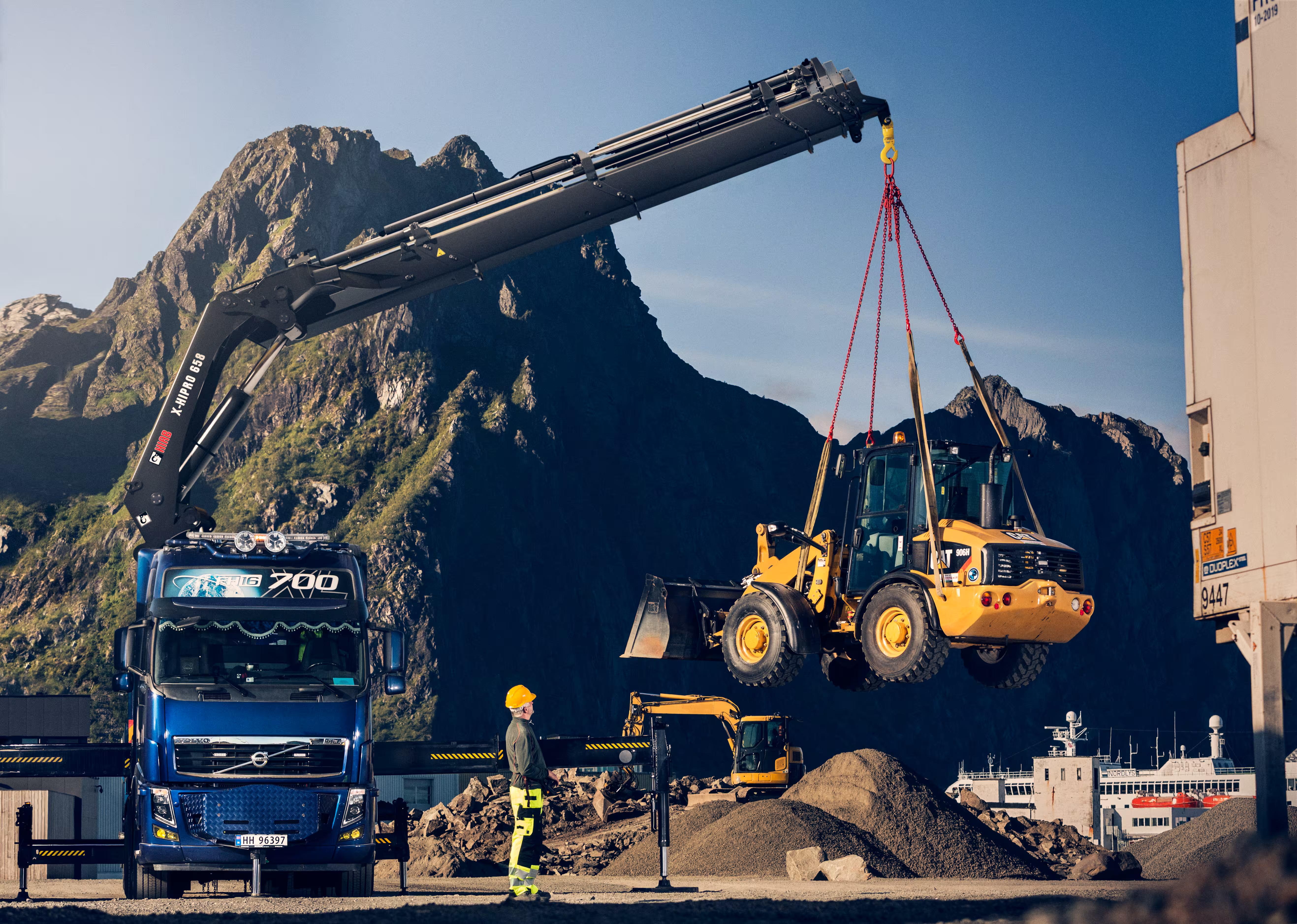 Truck lifting bulldozer