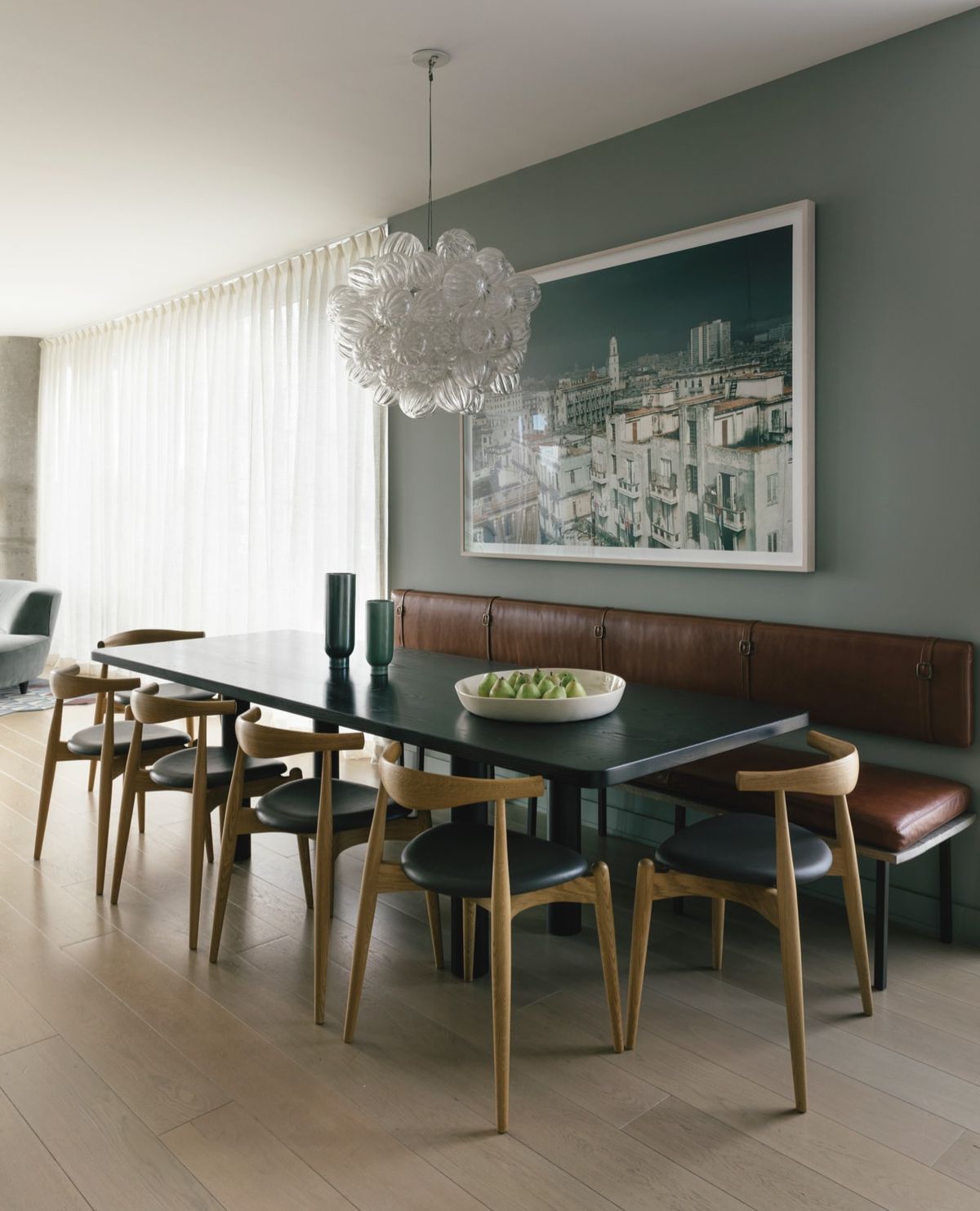 Leather banquette with dining table and six additional chairs