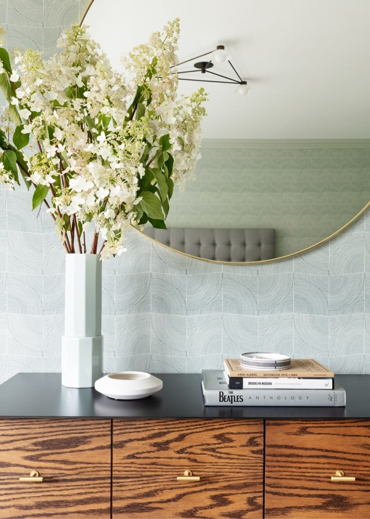 Credenza detail with flowers and mirror