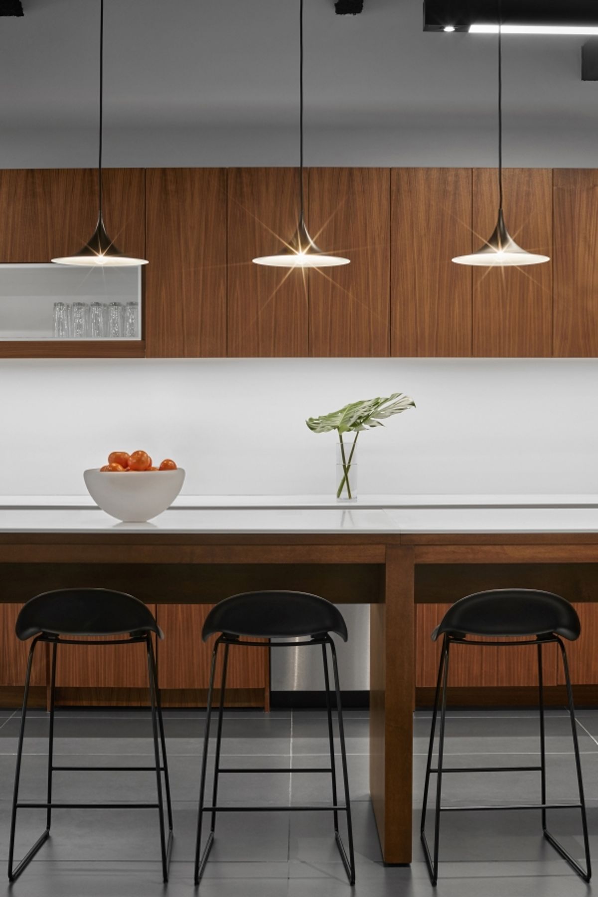 Detail in the kitchen with pendant lighting and counter seating