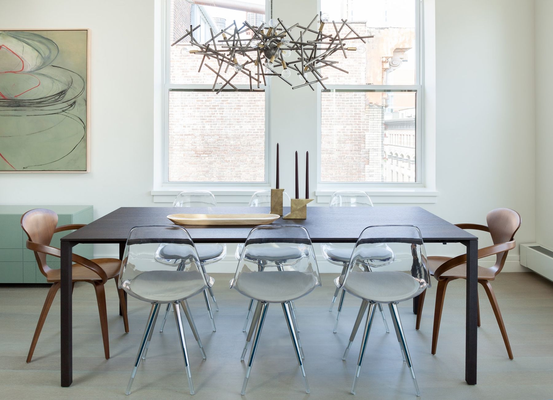 Dining table to seat 8 beneath abstract chandelier.