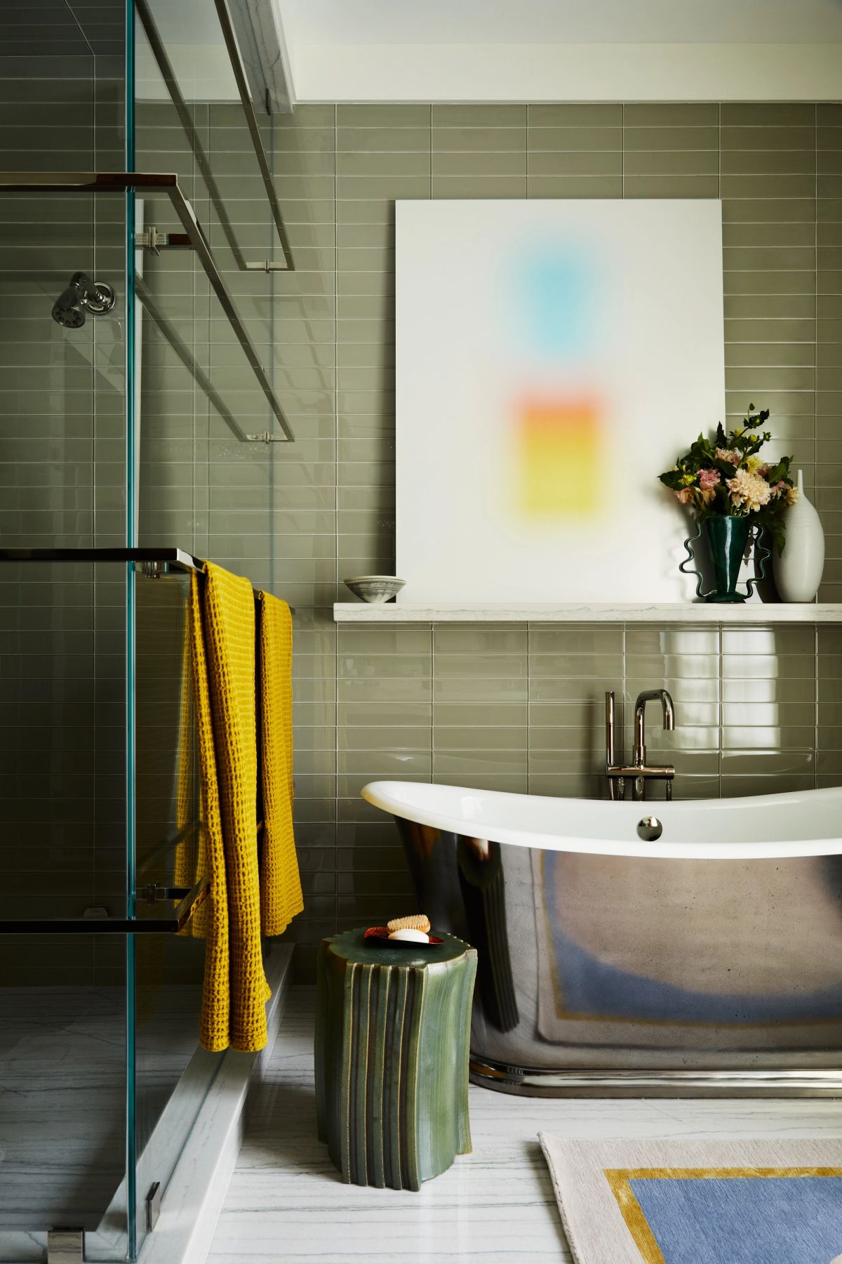 Primary bathroom with curved tub, shower room and green tile