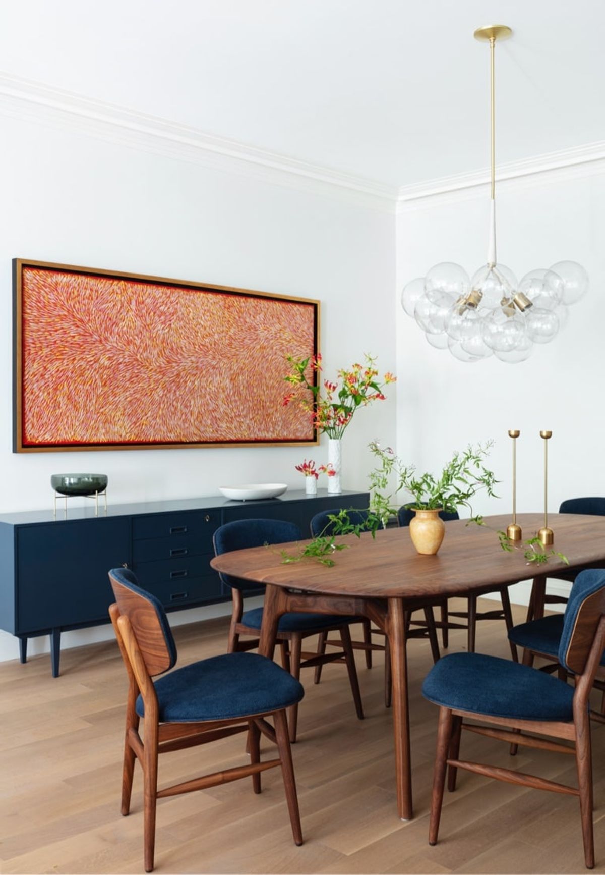 Dining table, credenza, art and chandelier
