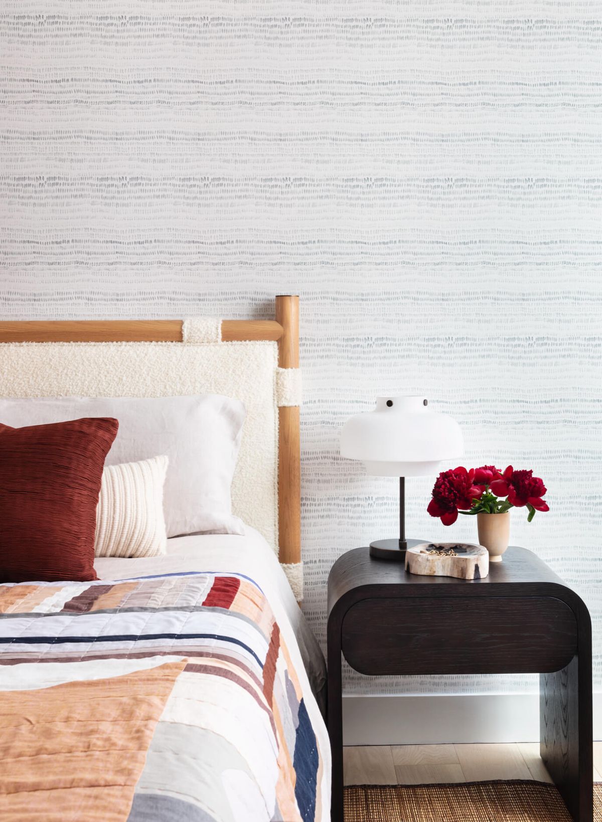 Vignette of bed frame and side table
