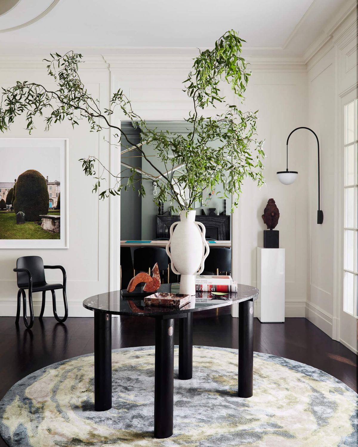 Vignette of table in foyer with dining room in the background