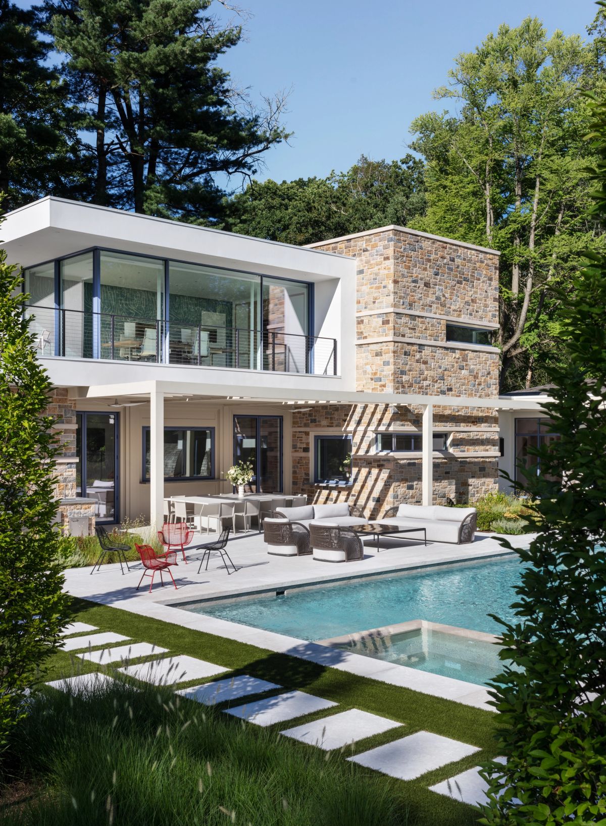 Poolside outdoor dining area and exterior of pool house