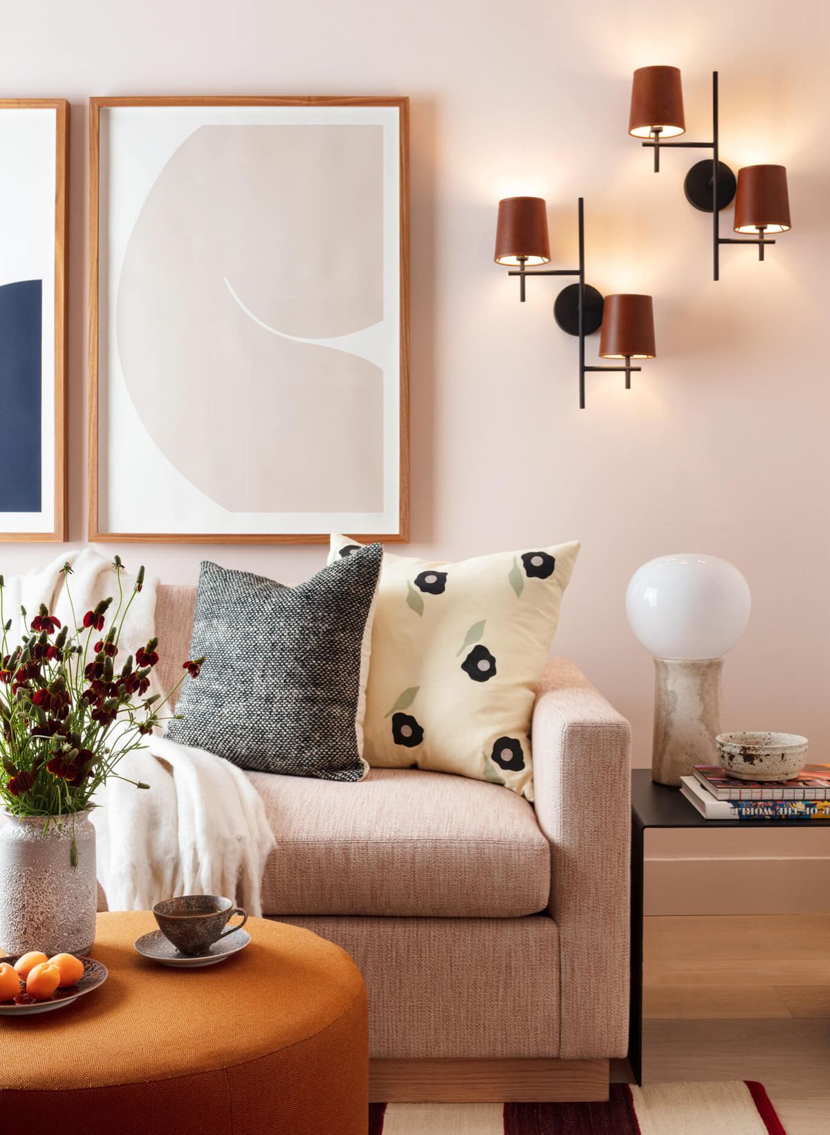 Detail of media room with soft peach walls, Caroline Walls framed atrwork