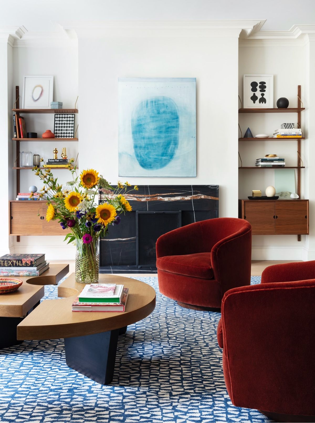 Vigenette with fireplace, shelving, chairs and coffee table