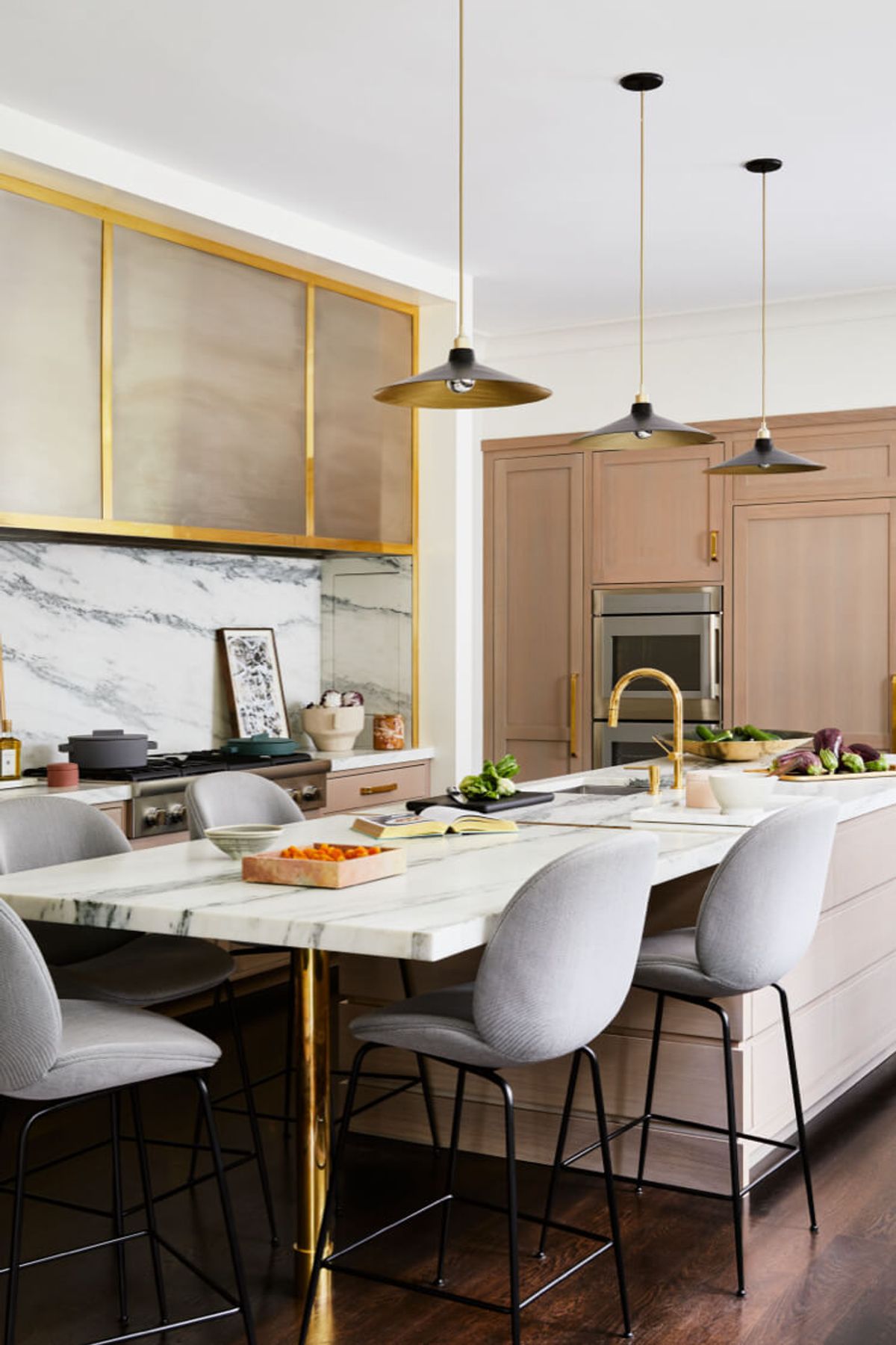 Kitchen island with marble counter and barstools