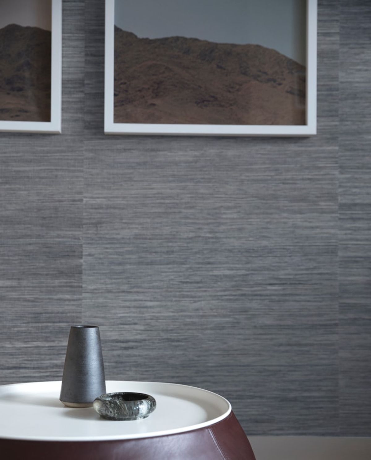 Detail of gray-heather wall paper and artwork