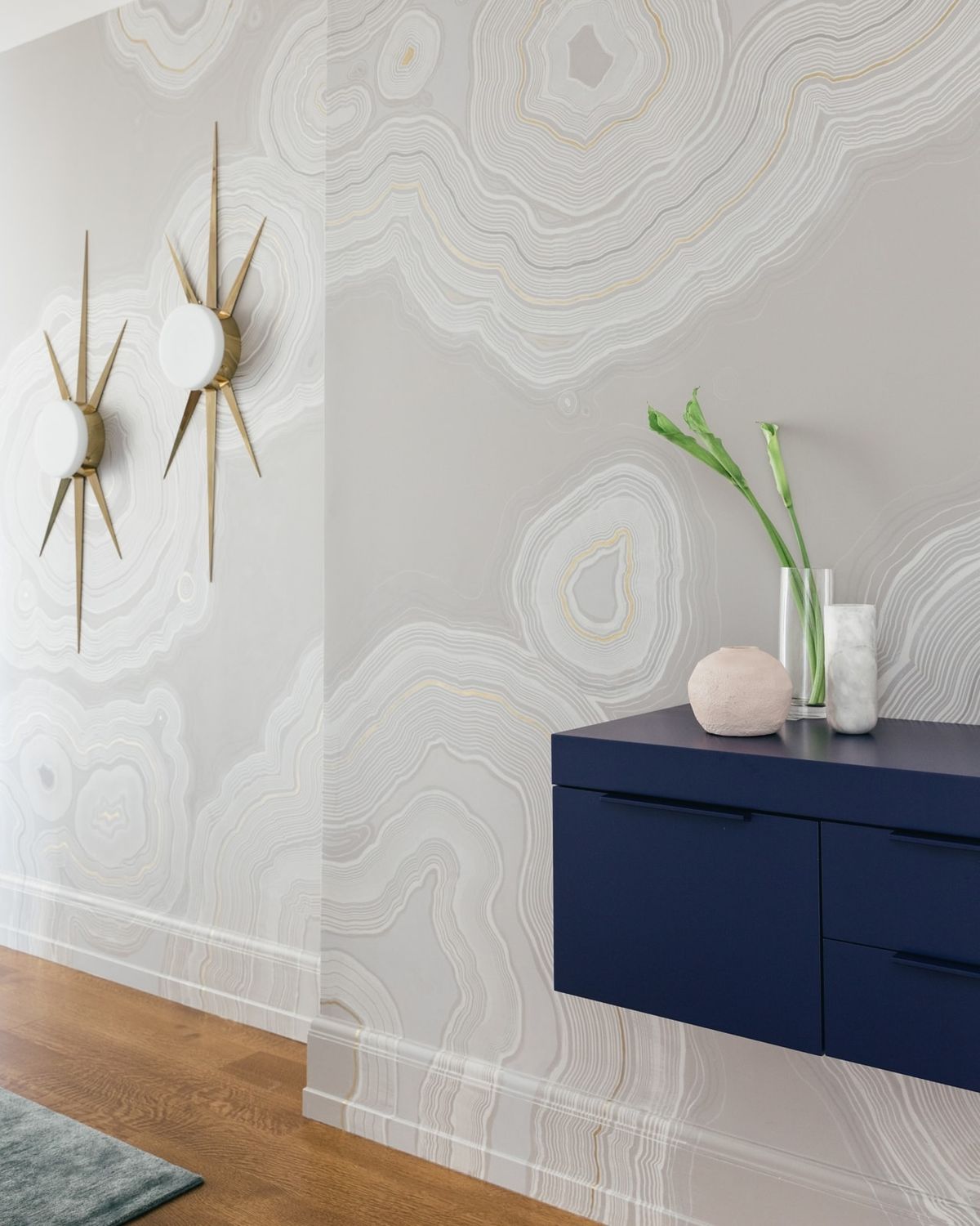 Detail of custom hand-painted wall mural and ornate sconces