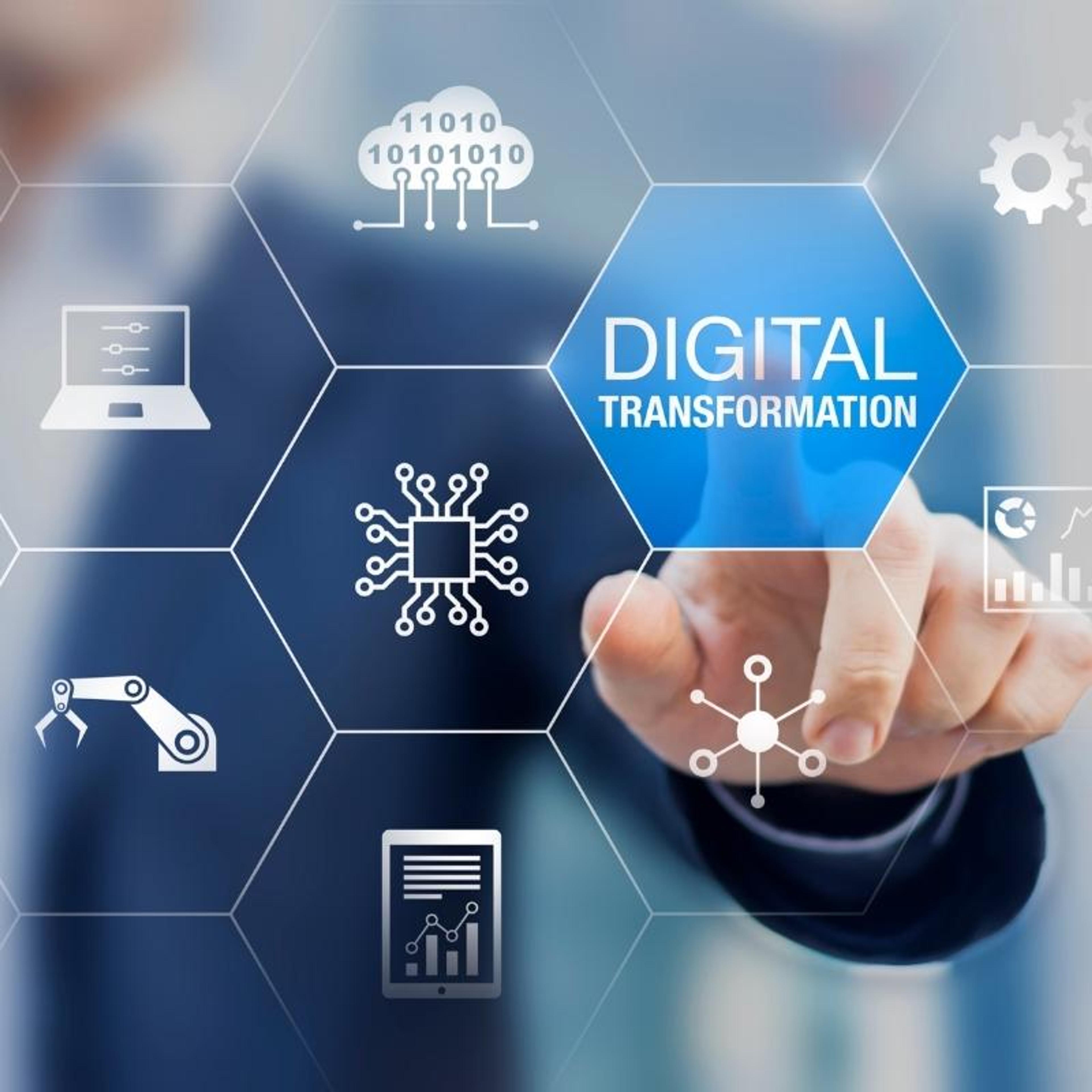 A man's hand is pressing a button that says digital transformation.