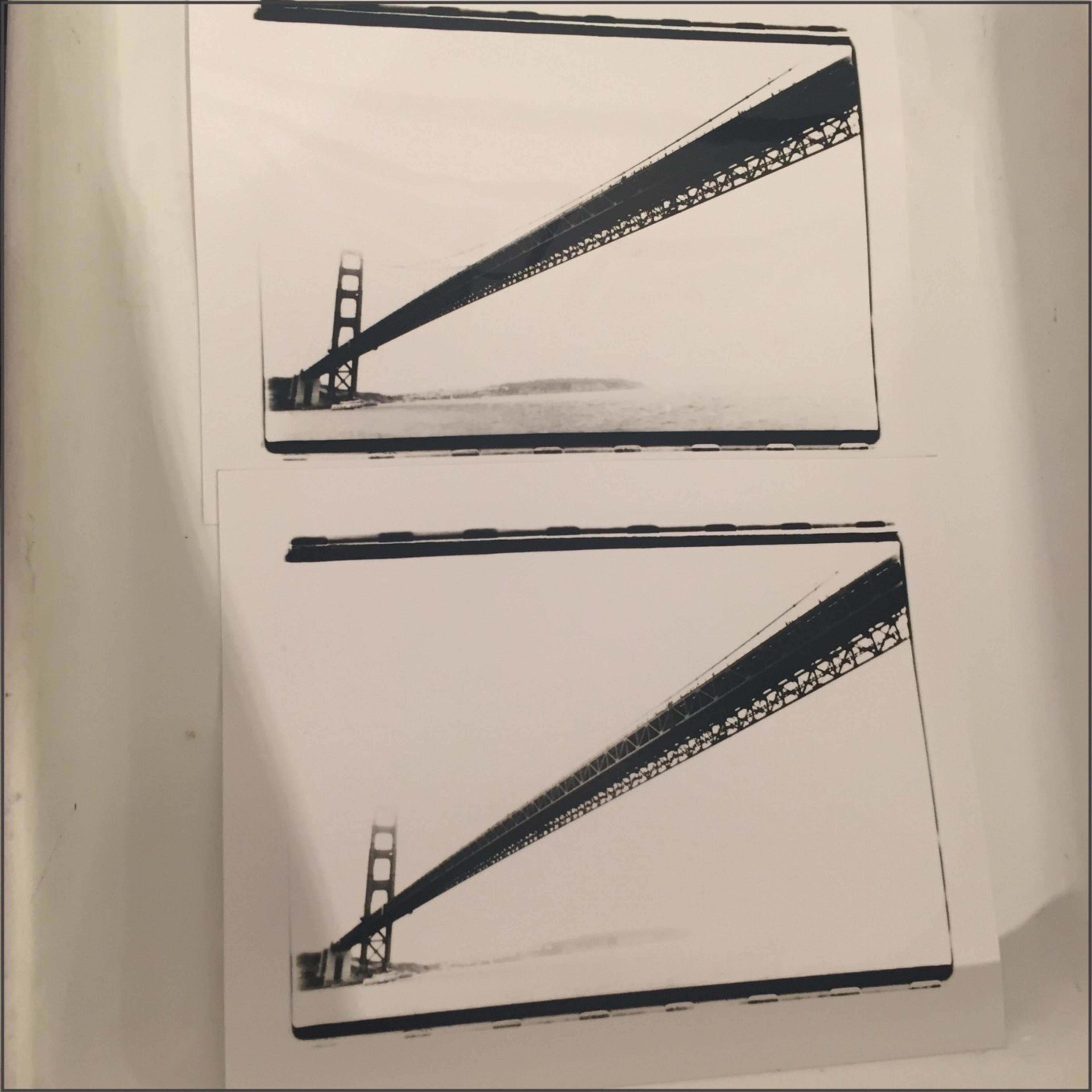 This image shows two photographs printed in a darkroom, both with the same negative. Although the contents are identical, the prints have different contrast and exposure parameters. The time to prepare, expose, and develop a single image on the photo-sensitive paper can take up to 5 minutes. This makes iteration and experimentation fairly time consuming. In contrast someone can use a smartphone and — in 60 seconds — take a few photos, pick and edit one, and post it to a social media account.