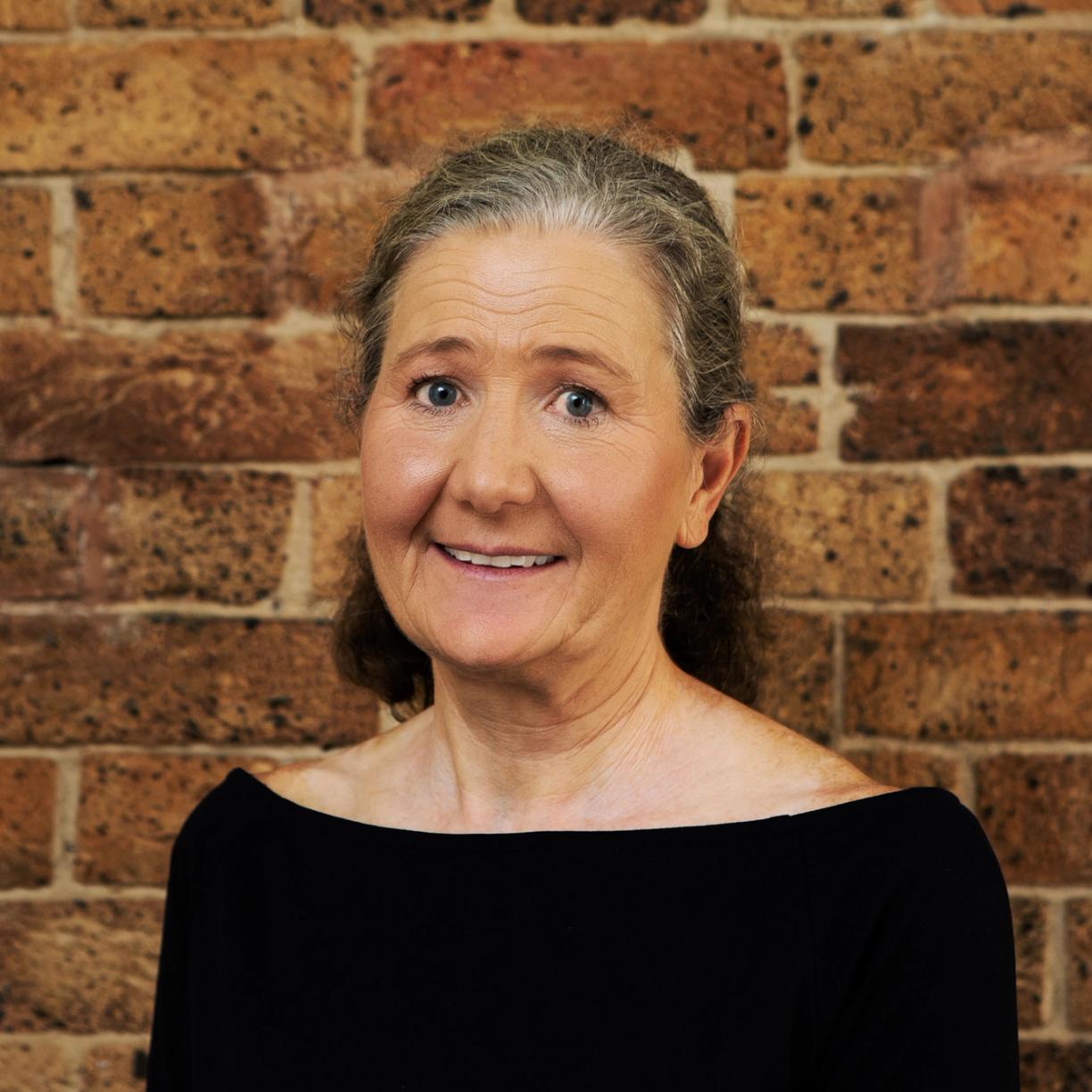 Household Capital Pension Boost Specialist Helen Cracknell smiles to camera