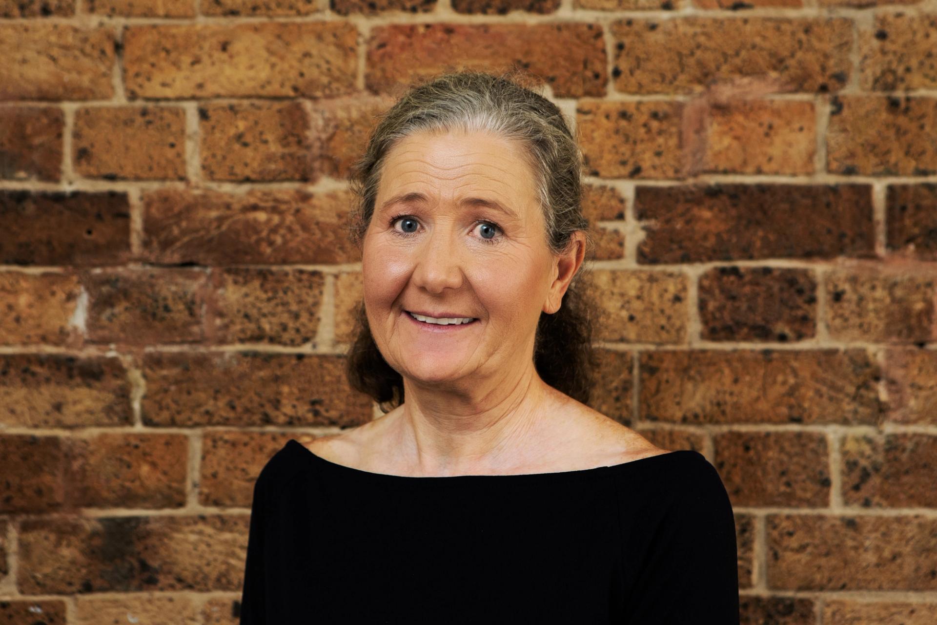 Household Capital Pension Boost Specialist Helen Cracknell smiles to camera
