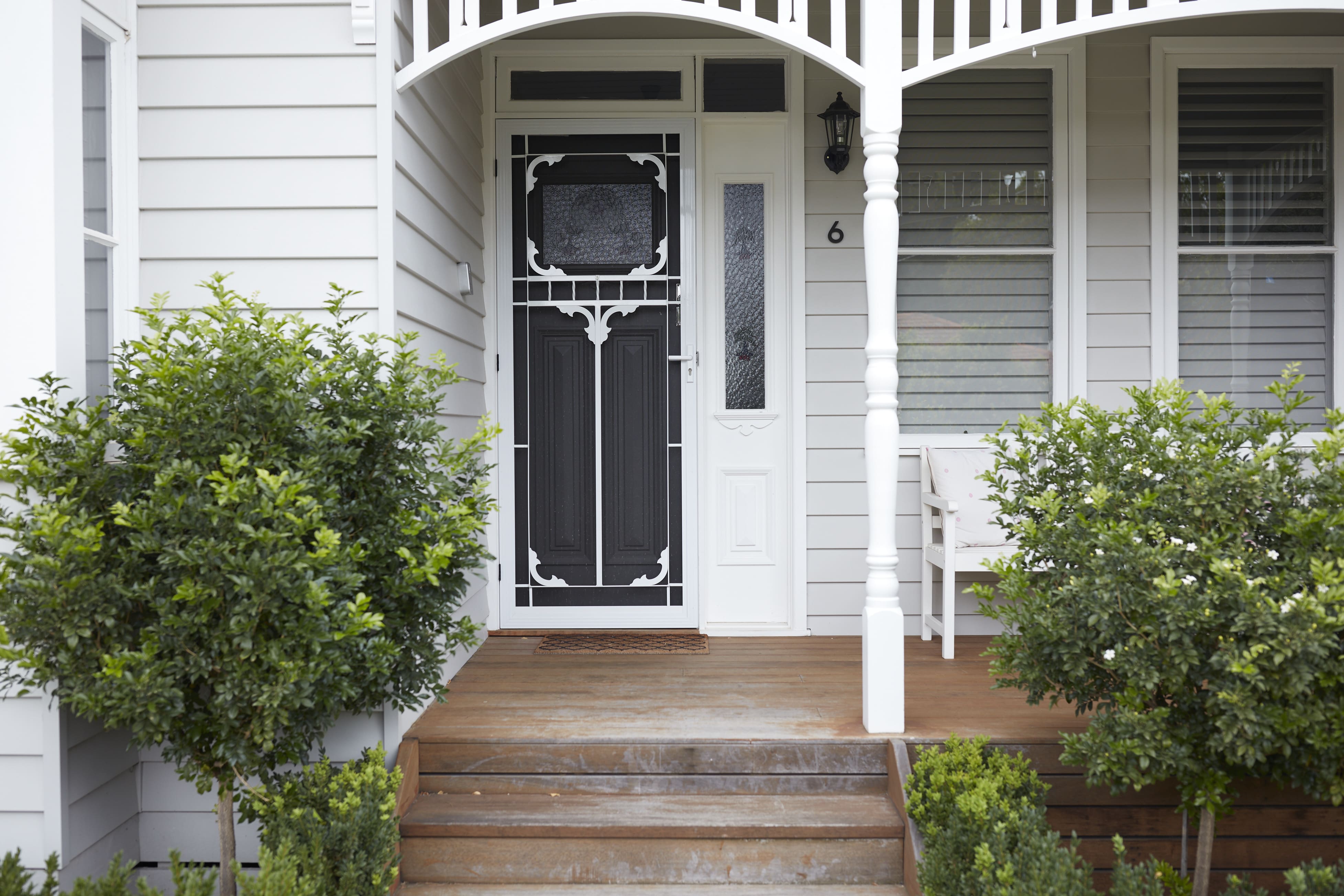 The front of a white weatherboard house