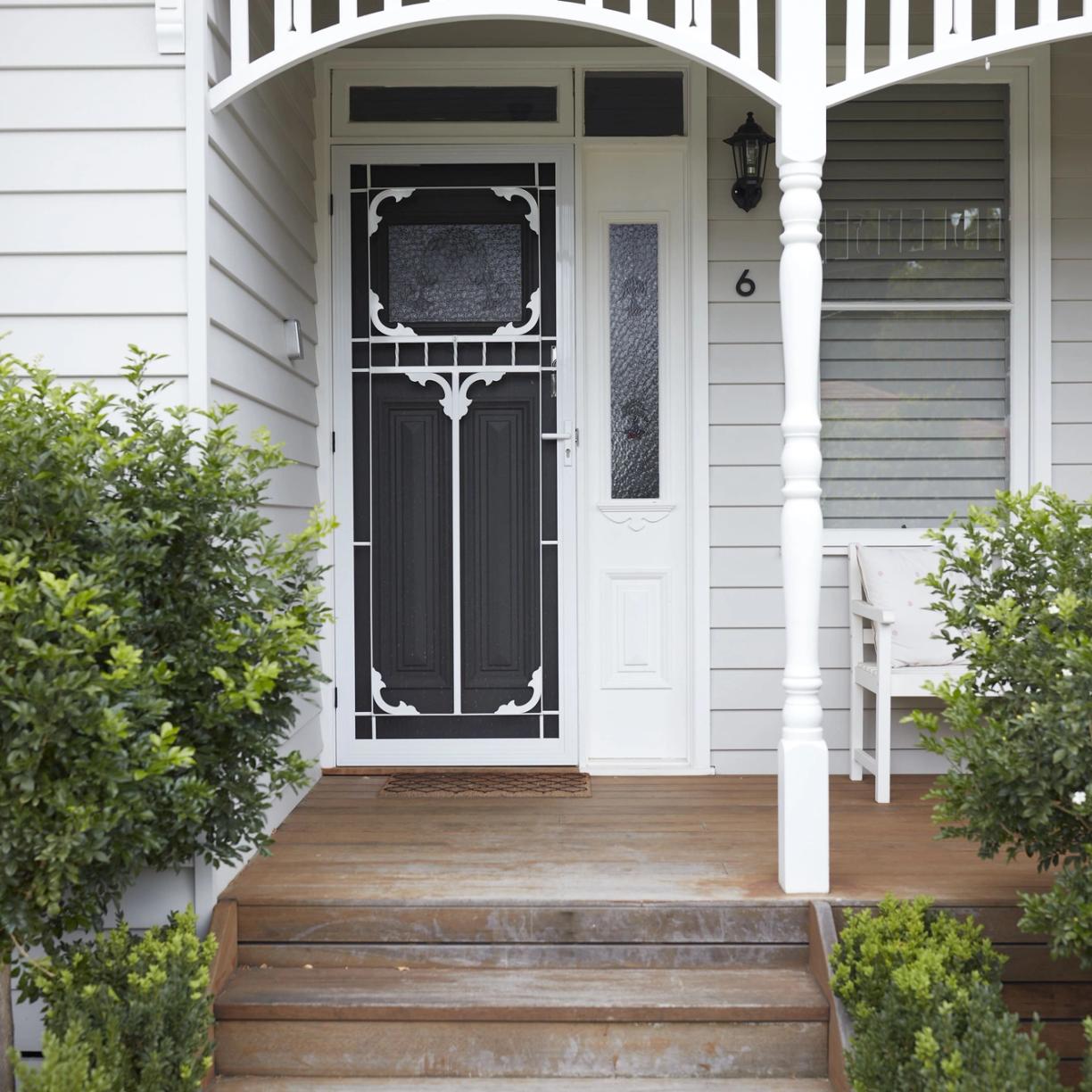 The front of a white weatherboard house