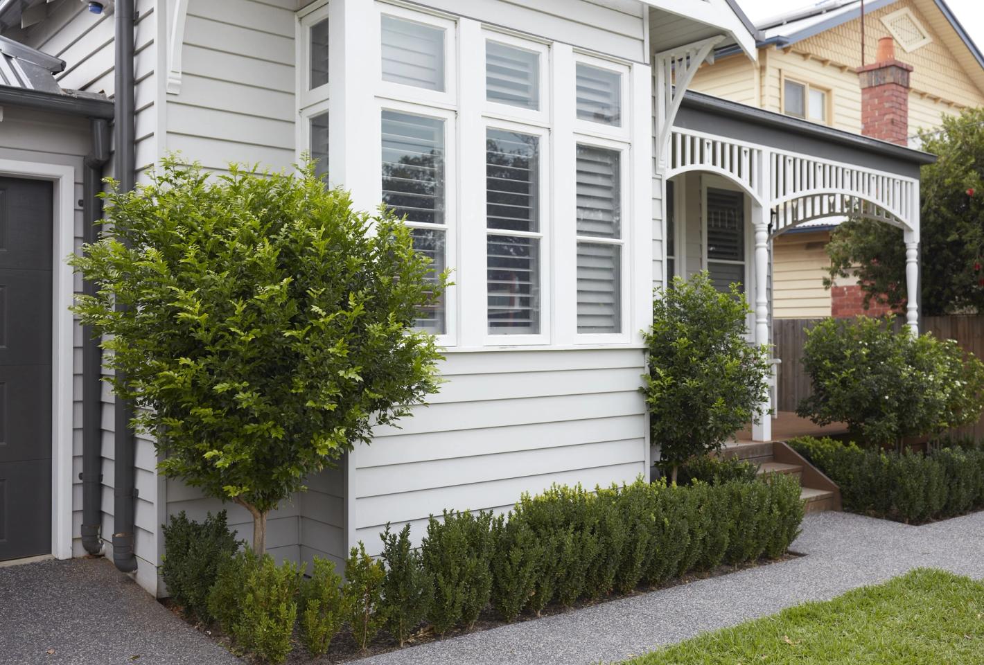 The front of a white weatherboard house