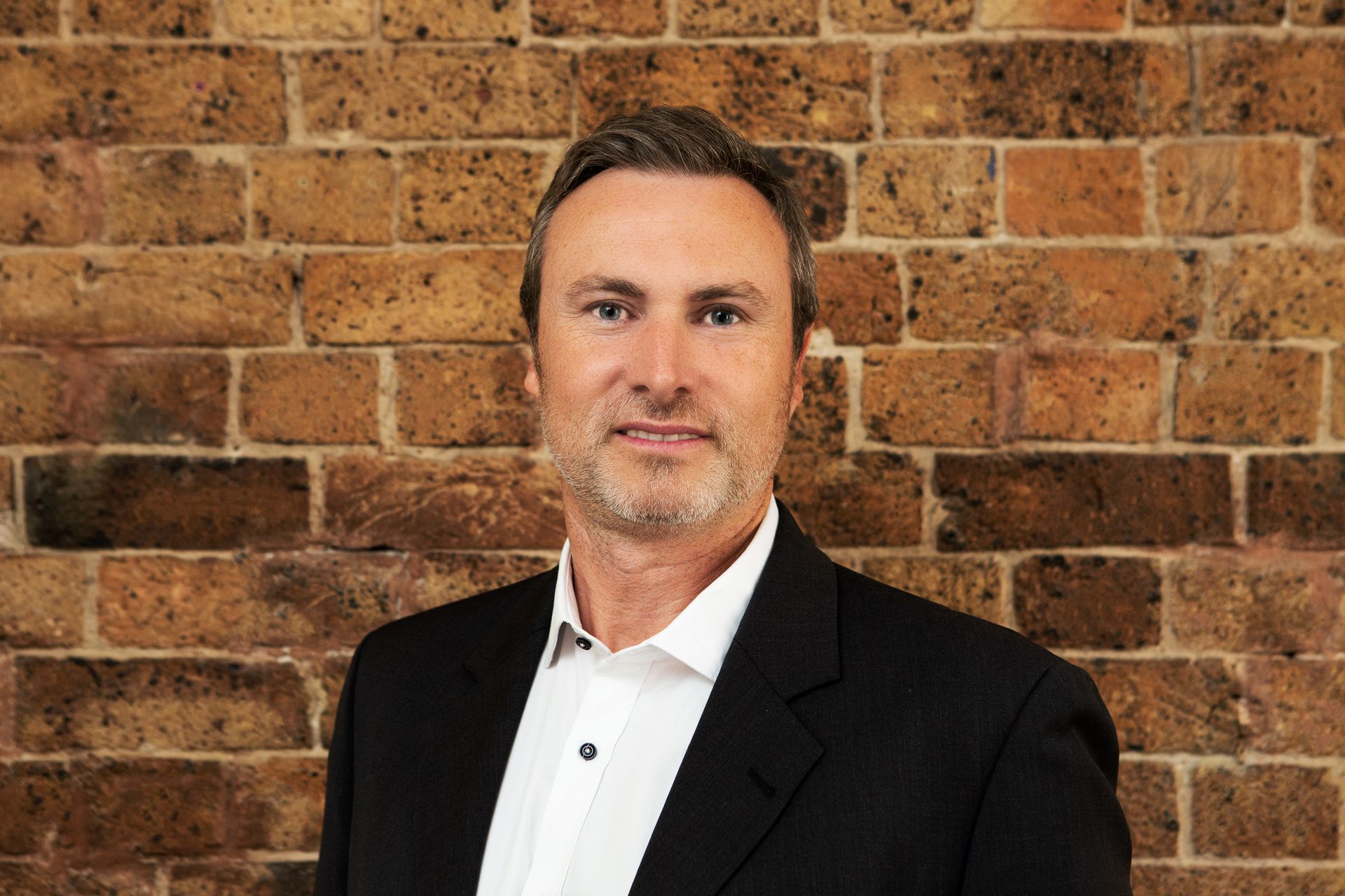 Household Capital Pension Boost Specialist Sam Pierce smiles to camera