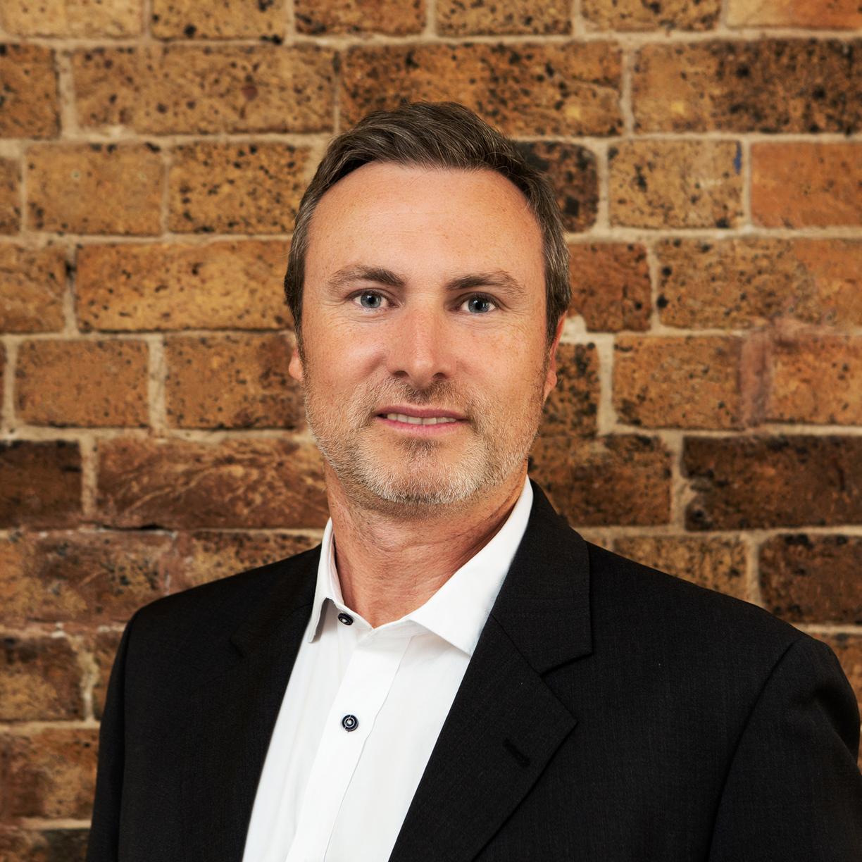 Household Capital Pension Boost Specialist Sam Pierce smiles to camera