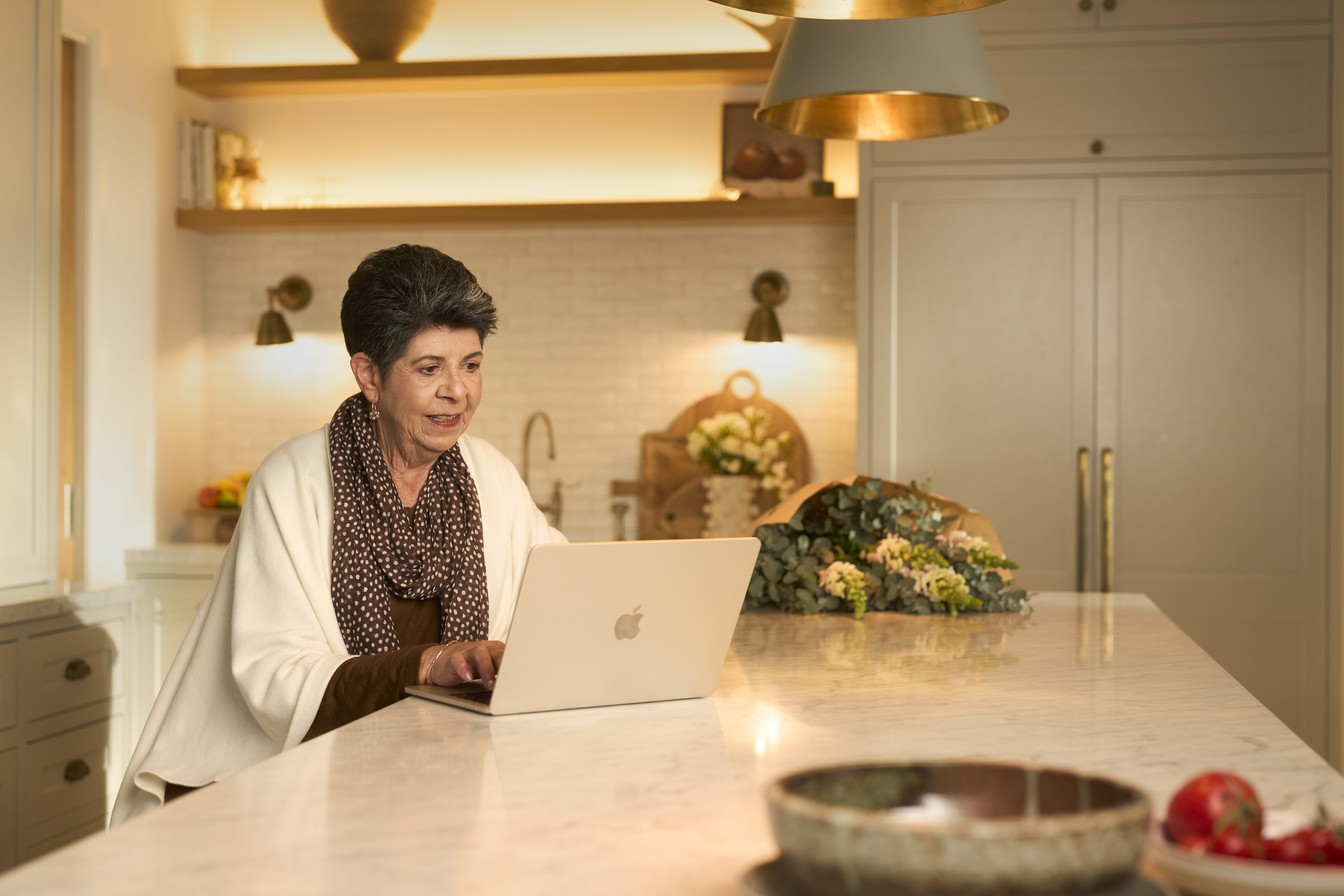 Lady sitting down using a laptop