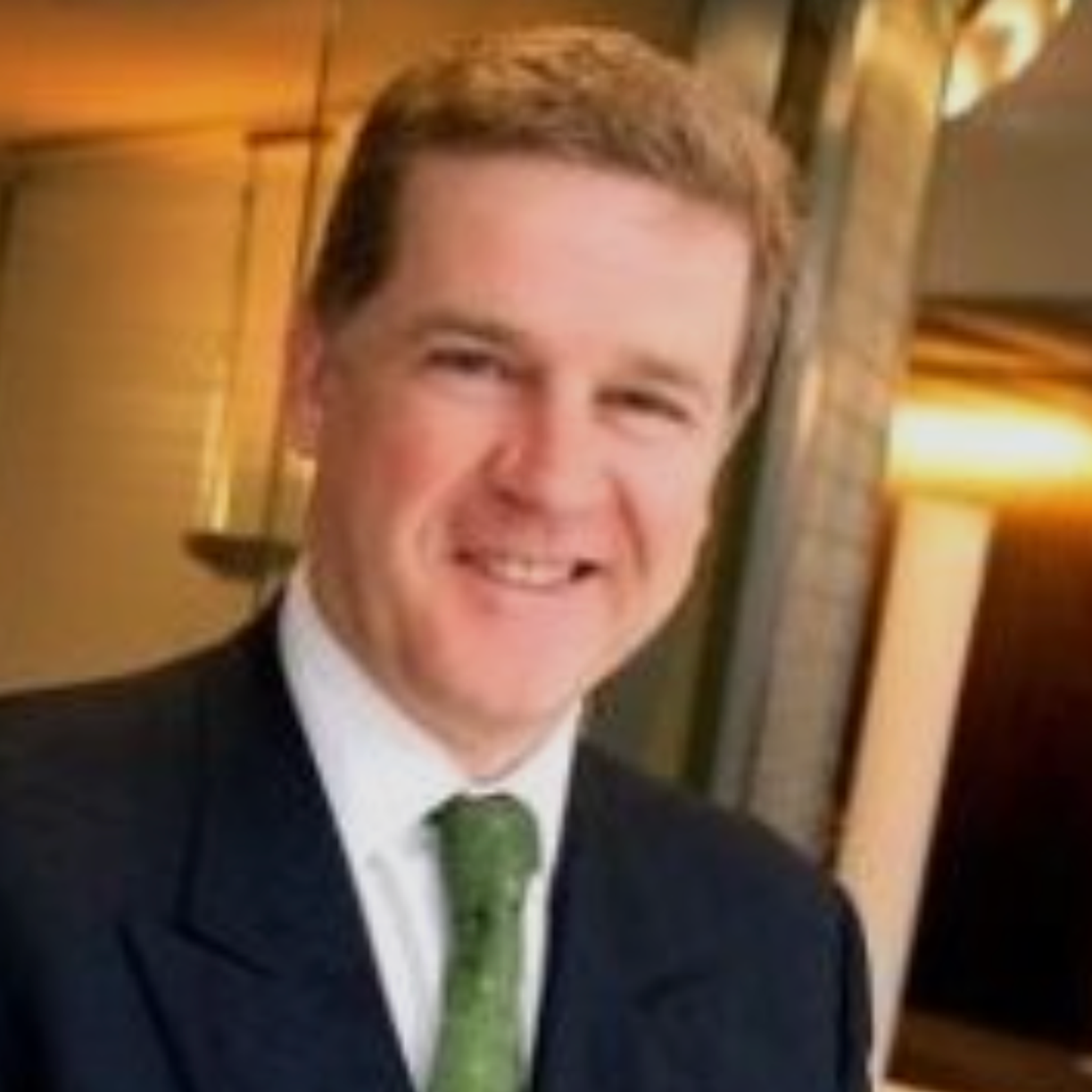 Man smiling in a suit