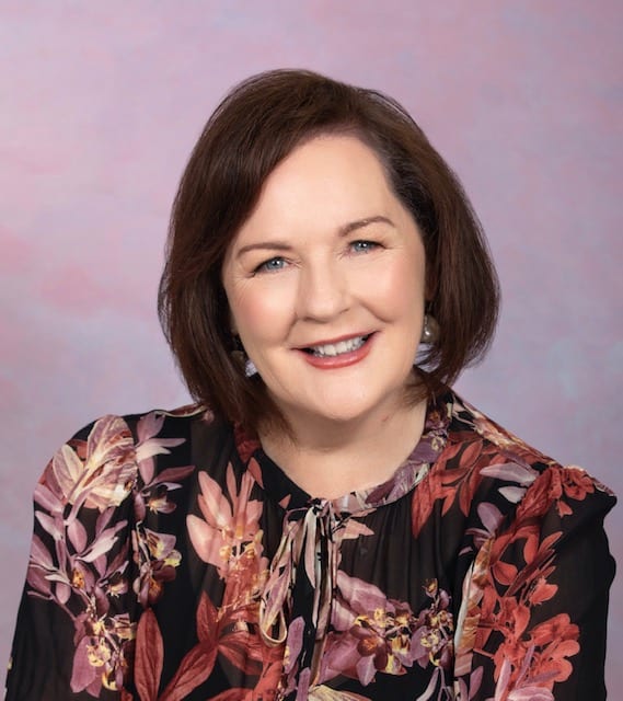 Lady in front of colorful background