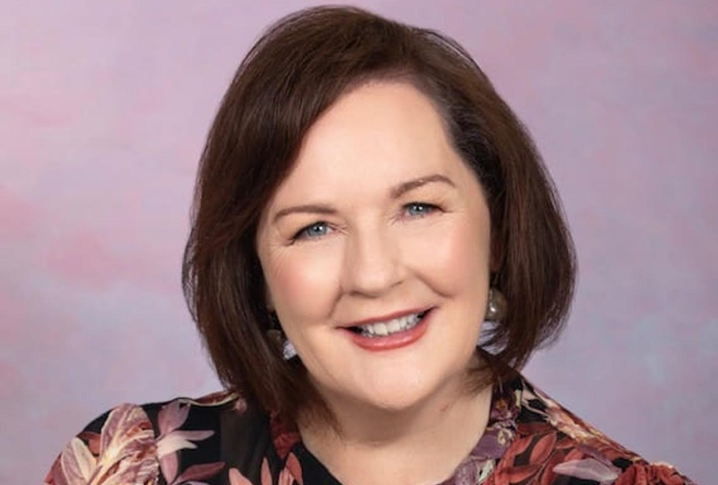 Lady in front of colorful background