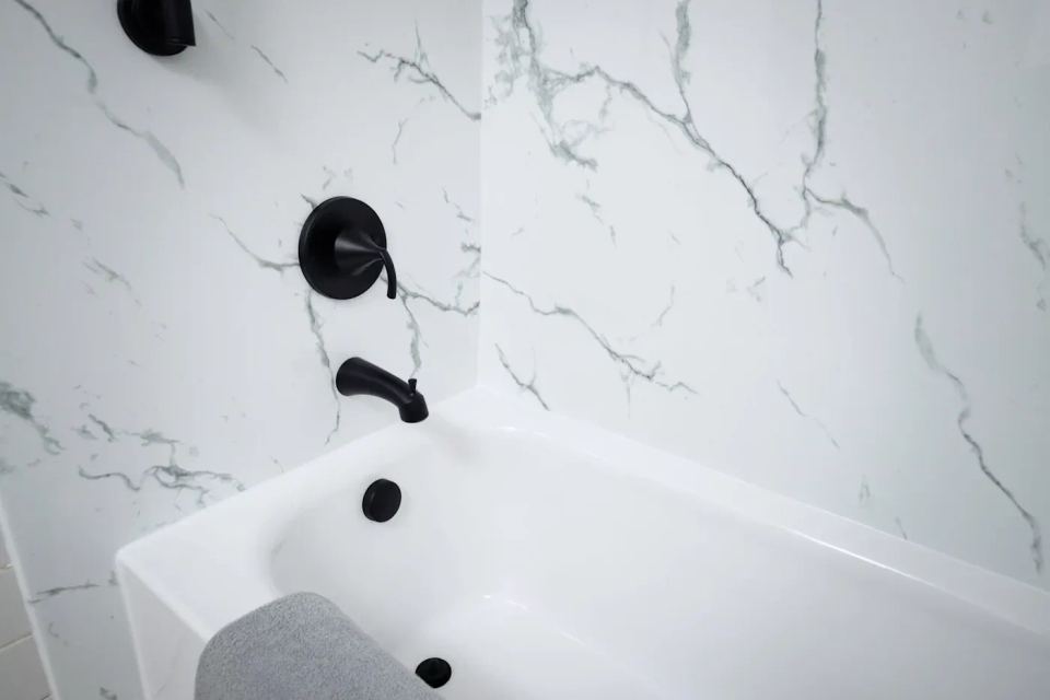 Newly remodeled bathtub with tiled surround