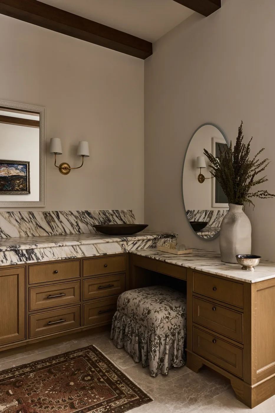 Bathroom vanity and dressing area with wood cabinetry and patterned stone