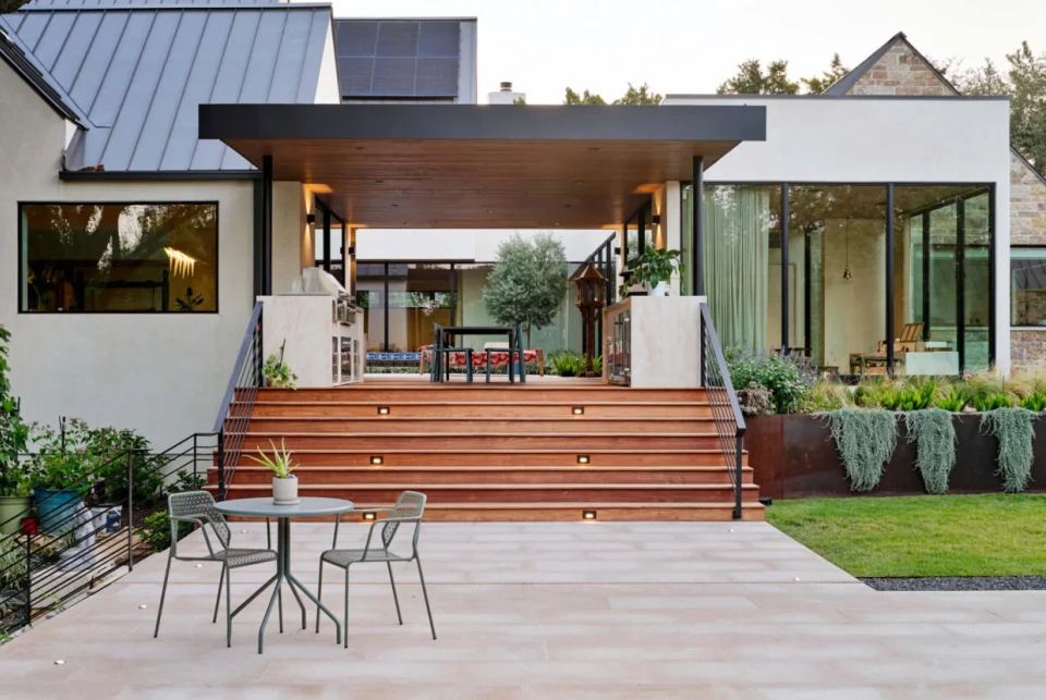 Residential outdoor terrace with timber steps and garden seating